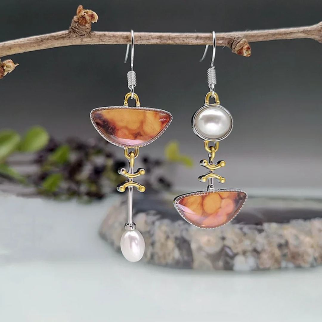 Vintage-style earrings with natural orange gemstones