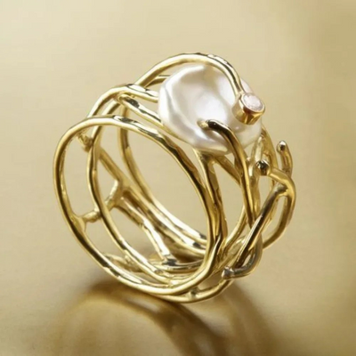 A combination of antique exquisite gold ring and pearls