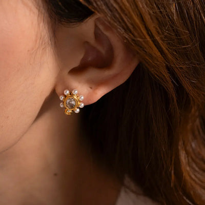 Elegant gold earrings with natural pearls